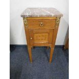 An antique French oak marble topped pot cupboard with gilt metal mounts