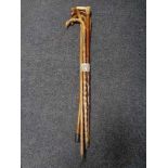 Five antique walking sticks (one with silver mount)
