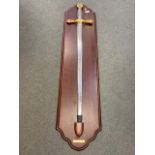 A large ornamental sword on wooden board - Excaliber