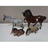 A Royal Doulton Brown gloss horse and foal together with two further horse figures (4)