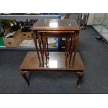 A nest of three walnut glass topped tables on cabriole legs together with similar coffee table