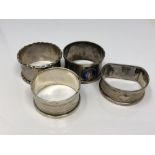 Four assorted silver napkin rings, one enamelled CONDITION REPORT: 56.