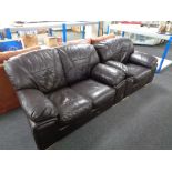 A brown leather two seater settee with matching armchair