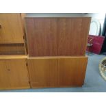 Two mid century Danish teak double door cabinets