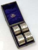 A good set of four silver napkin rings with engine turned decoration, numbered 1 2 3 4,