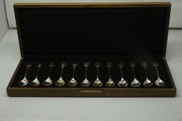 A set of twelve silver teaspoons issued by John Pinches for the Royal Society for the Protection of