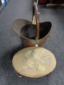 A Victorian mahogany-framed oval-shaped footstool, on four cabriole legs,