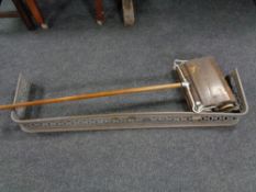 An antique copper fire curb together with a vintage Ewbank carpet sweeper
