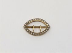 An antique 15ct gold pearl set buckle, 2.13g.