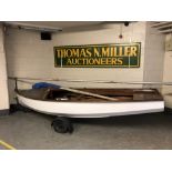 A 14' sailing boat with sail, with plaque 'Built by The Aln Boatyard, Alnmouth',