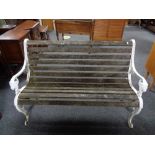 An early twentieth century cast iron wooden slatted garden bench with lion mask arms