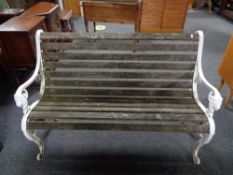 An early twentieth century cast iron wooden slatted garden bench with lion mask arms
