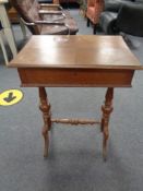 A late nineteenth century oak sewing table,