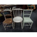 A painted Ibex kitchen chair together with two further painted chairs