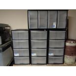 Four plastic four drawer storage chests