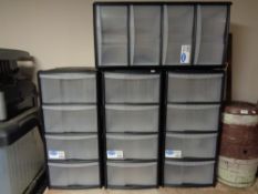 Four plastic four drawer storage chests