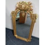 A decorative gilt framed hall mirror.
