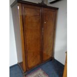 A walnut Queen Anne style double door wardrobe