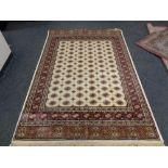 A cream ground Bokhara rug 240 cm x 160 cm
