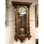 A late 19th century walnut cased Vienna regulator wall clock, with pendulum,