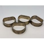 A set of four silver napkin rings, Birmingham marks CONDITION REPORT: 46.