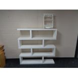 A set of contemporary Ikea shelves together with two tier wall shelf