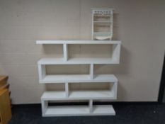 A set of contemporary Ikea shelves together with two tier wall shelf