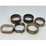 Six assorted silver napkin rings CONDITION REPORT: 55.