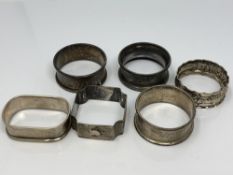 Six assorted silver napkin rings CONDITION REPORT: 55.