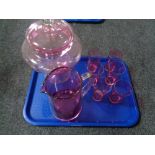 A tray of cranberry glass ware, waterjug, six beakers,