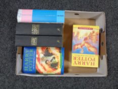 A box of five Harry potter volumes to include Half Blood Prince (first Edition with printing error).