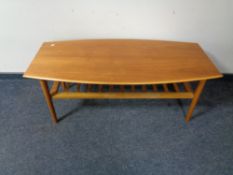 A twentieth century teak coffee table with undershelf