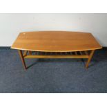 A twentieth century teak coffee table with undershelf