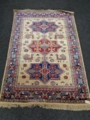 A golden Aztec design kashmir rug 120 cm x 170 cm