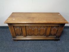 An oak linen fold blanket box