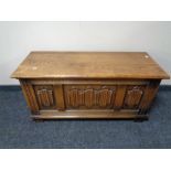 An oak linen fold blanket box