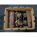 A box of three pairs of vintage wooden lawn bowls in leather bags