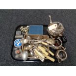 A tray of three piece plated tea service, cutlery, vintage RAC badge, cased Deco tea spoons,