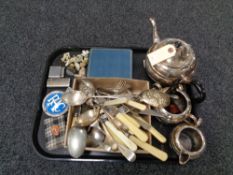 A tray of three piece plated tea service, cutlery, vintage RAC badge, cased Deco tea spoons,