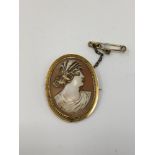 An antique gold cameo brooch