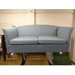A twentieth century two seater settee in blue fabric