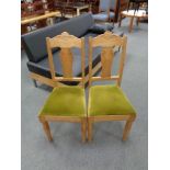 A set of five twentieth century blond oak dining chairs