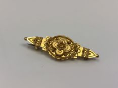 An antique ornate 15ct gold brooch CONDITION REPORT: 3.