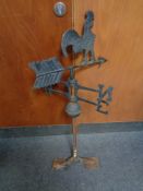 A cast iron cockerel weather vane