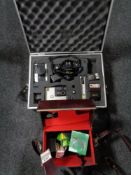 An aluminium case containing a Canon T-50 camera with lens, Kodak and Fujica camera,