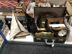 A vintage luggage case containing a quantity of mid century and later mantle and wall clocks,