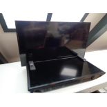 A Philips 40 inch LCD TV on stand together with a Samsung 32 inch LCD TV (no stand) with remotes no