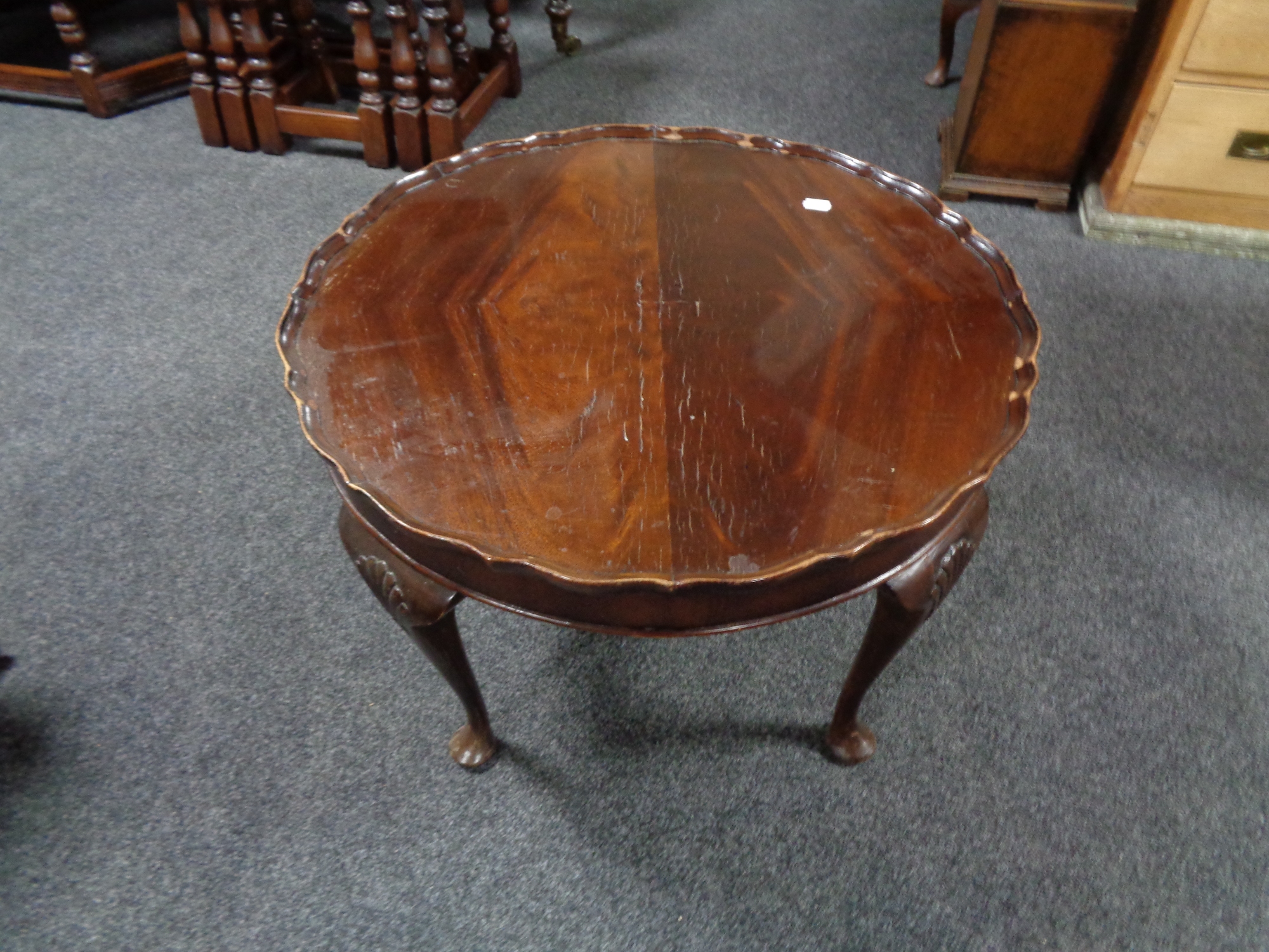 A mahogany pie crust edge coffee table