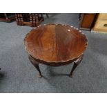 A mahogany pie crust edge coffee table