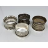 Four assorted silver napkin rings CONDITION REPORT: 68.